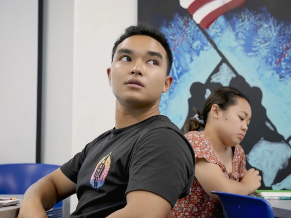 Two ROTC Naval students attending classroom lecture