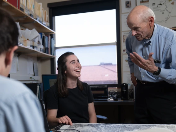 faculty talking with student