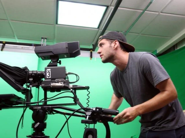 Student behind news camera