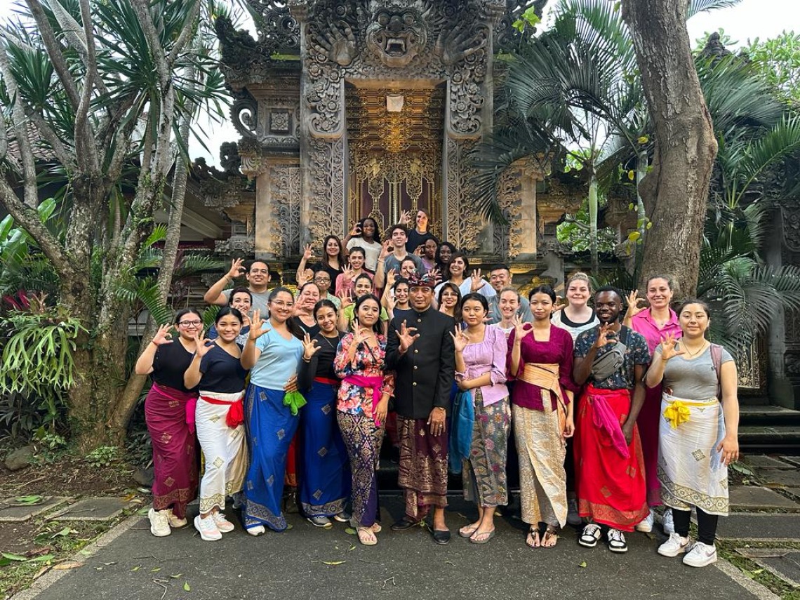 CIELO students posing for a picture in Bali. In front of a temple
